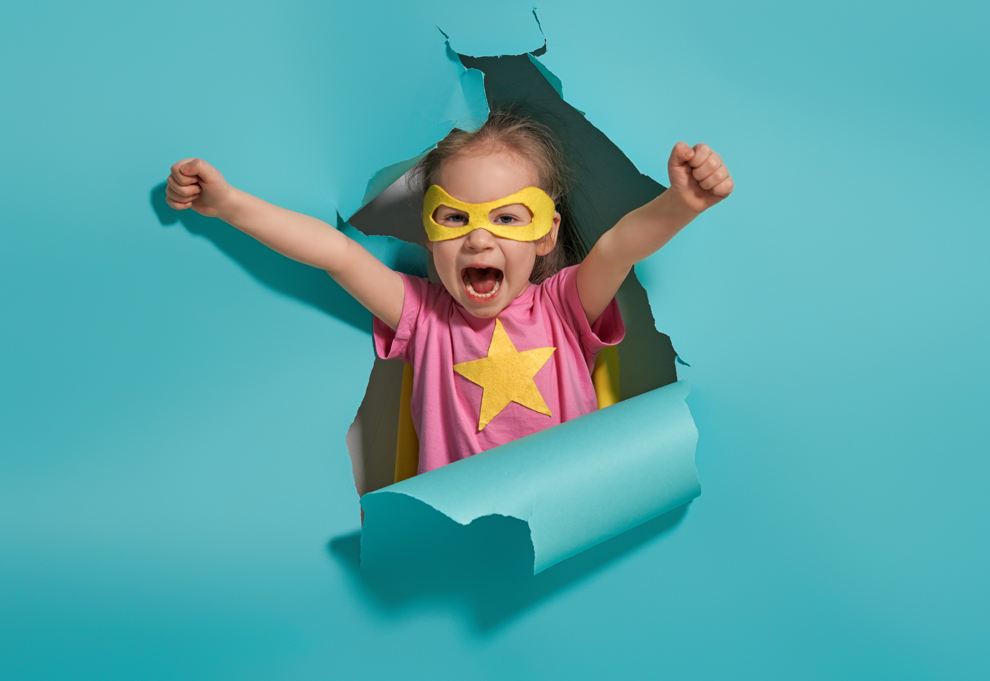 child playing superhero